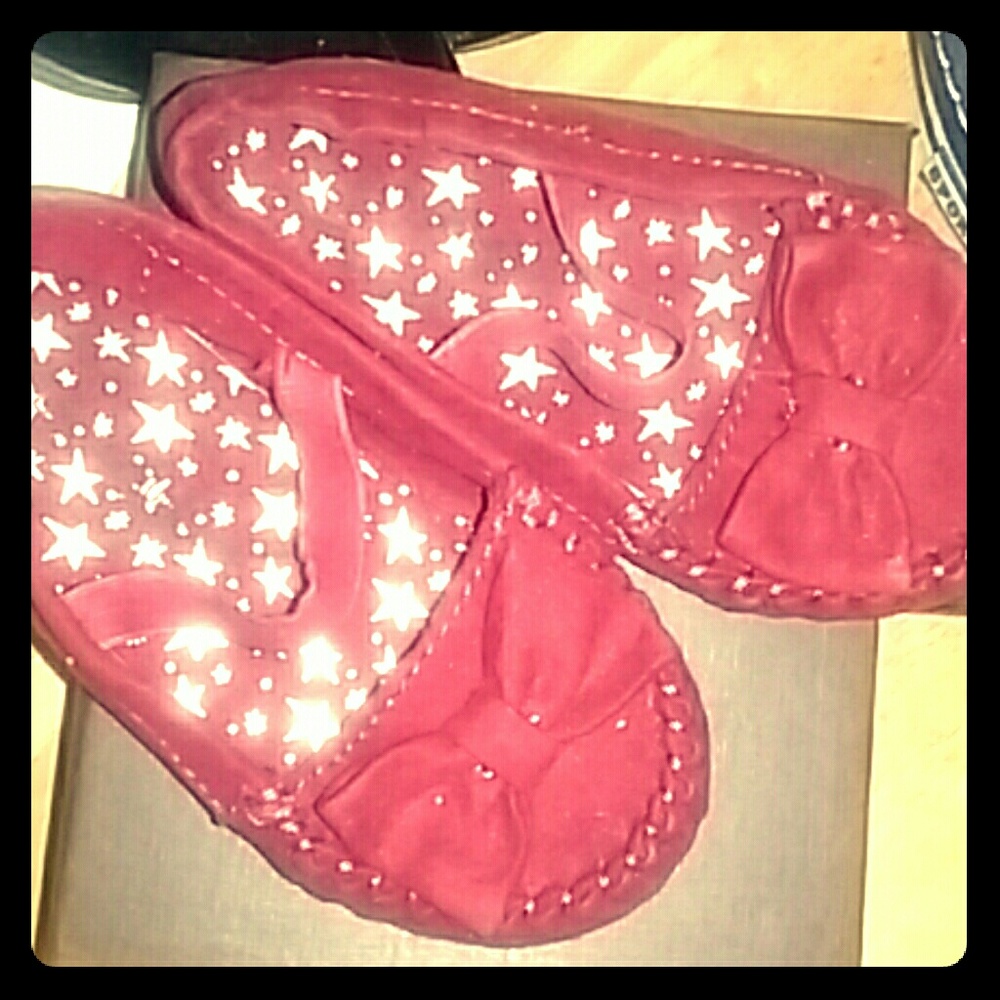 Red moccasin style shoes